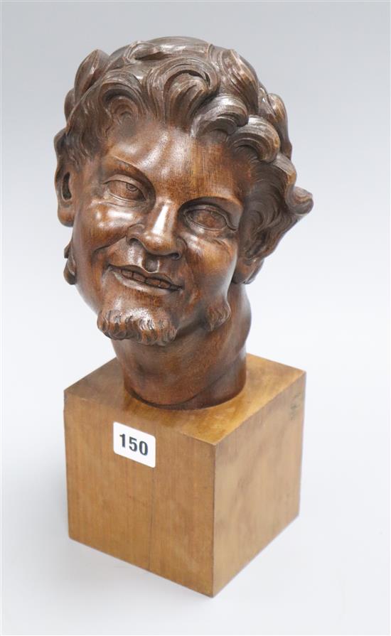 A French carved head of a faun, signed M. Malon